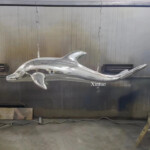 large outdoor dolphin statues