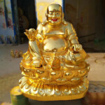 laughing gold buddha statue