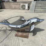 dancing dolphin statue