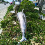 dolphins leaping garden ornament