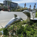 dolphins leaping garden ornament