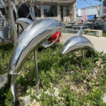 dolphins leaping garden ornament