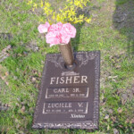 flat bronze headstone with vase