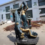 large outdoor mermaid statues