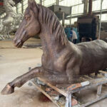 life size bronze horse statue reclining pose