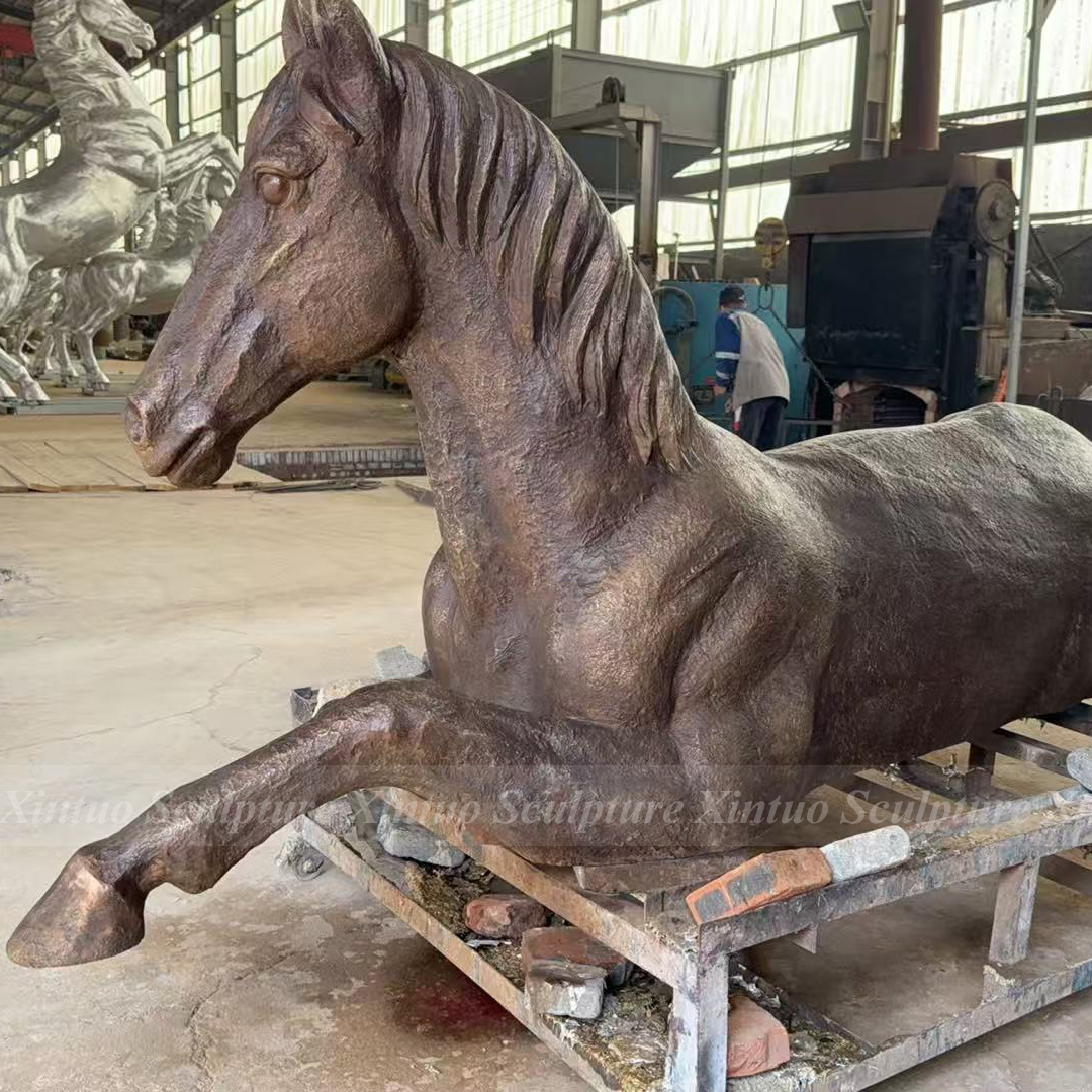 life size bronze horse statue reclining pose