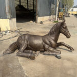 life size bronze horse statue reclining pose