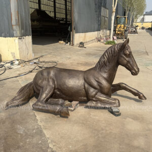 life size bronze horse statue reclining pose