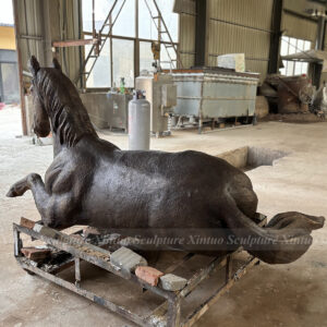 life size bronze horse statue reclining pose