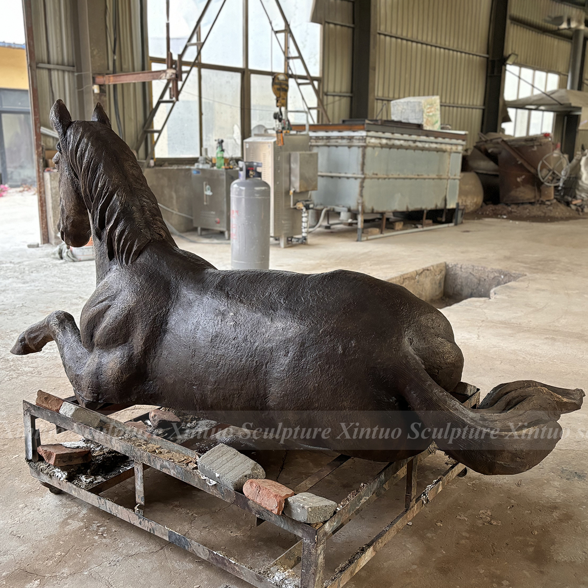 life size bronze horse statue reclining pose