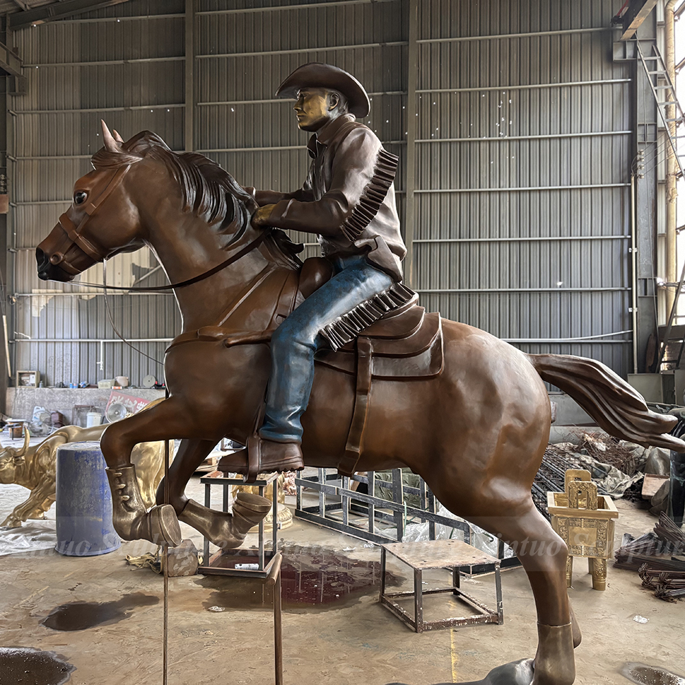 Bronze Cowboy Riding Horse Sculpture