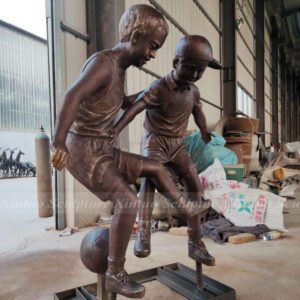 Children Playing Soccer Statue