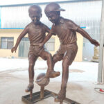 Children Playing Soccer Statue
