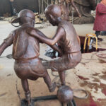 Children Playing Soccer Statue
