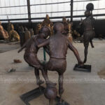 Children Playing Soccer Statue