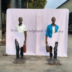 Man with Suitcase Sculpture