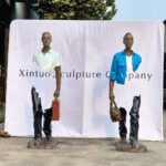 Man with Suitcase Sculpture