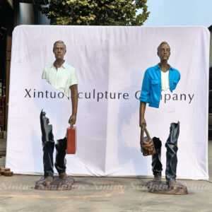 Man with Suitcase Sculpture